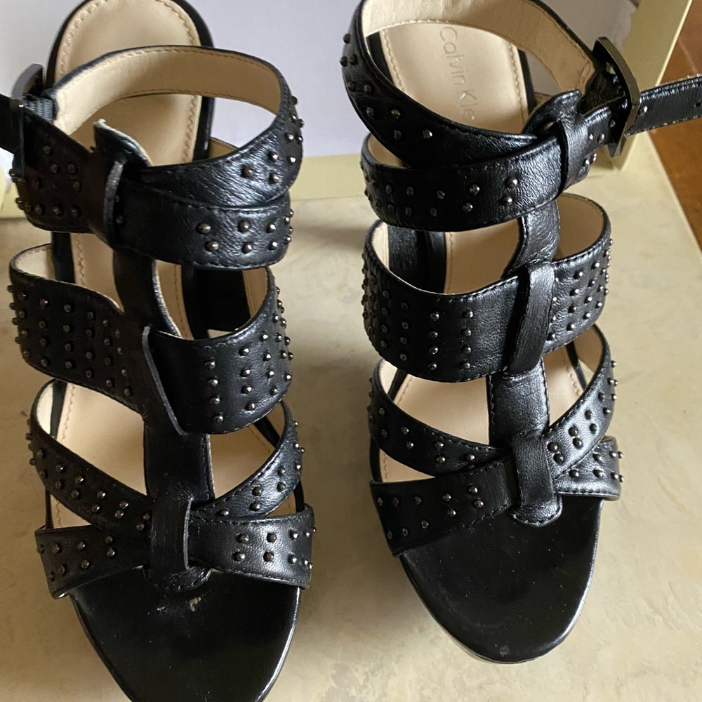 Strappy 3.5 inch heels. Black leather with dark gray studs.